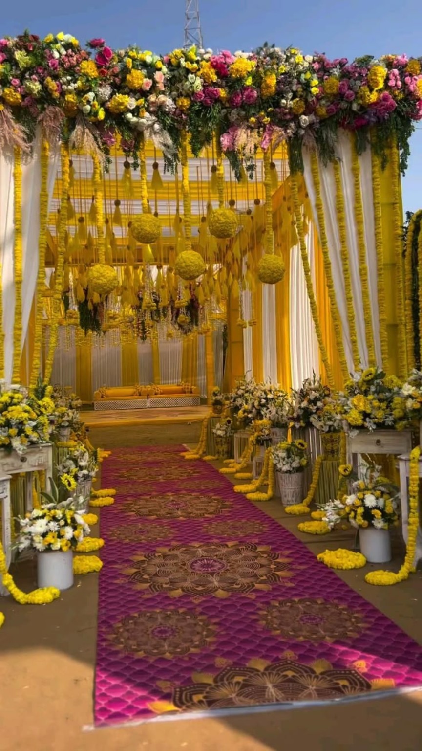 Yellow and white marigold wedding entrance decor