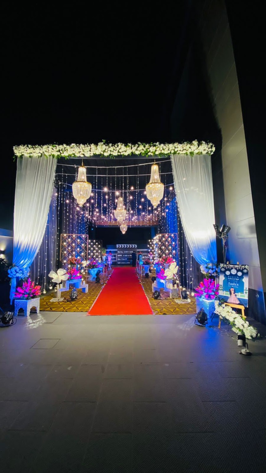 Luxury event entrance with chandeliers and red carpet